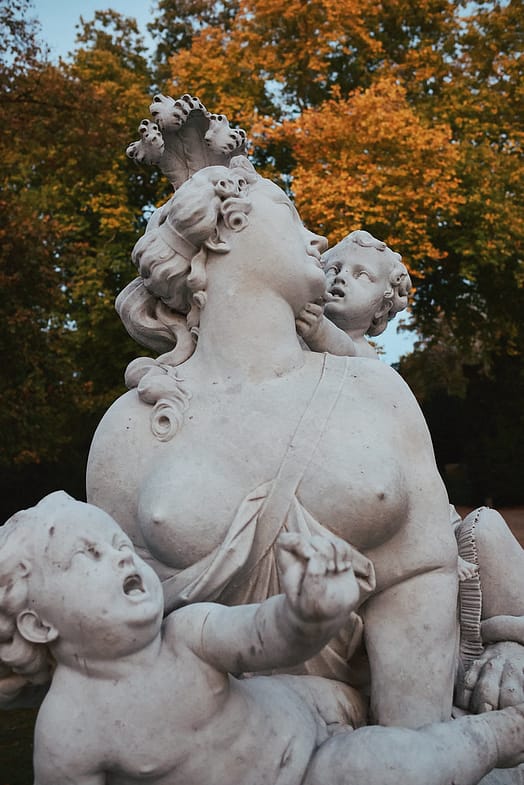 Full-breasted sphinx with putti in Potsdam
